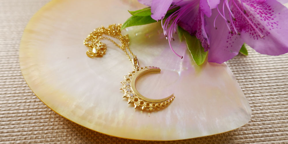 The Crescent Moon necklace, honoring the fluidity of the lunar cycle