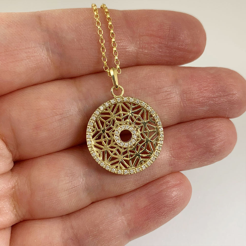 disc necklace in 14k gold and diamonds